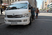 Commuters getting into a taxi: Image: File Photo