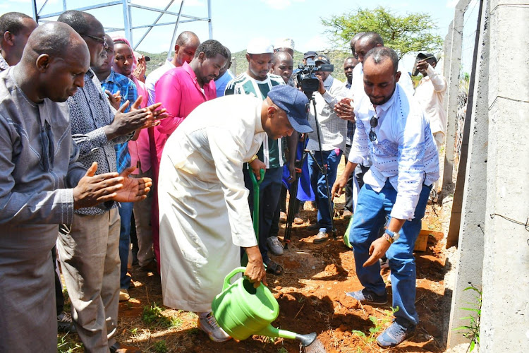 Isiolo Governor Abdi Hassan planting a tree ahead of launching water projects in Ngaremara ward, Isiolo marking World Water Day on March 22, 2024