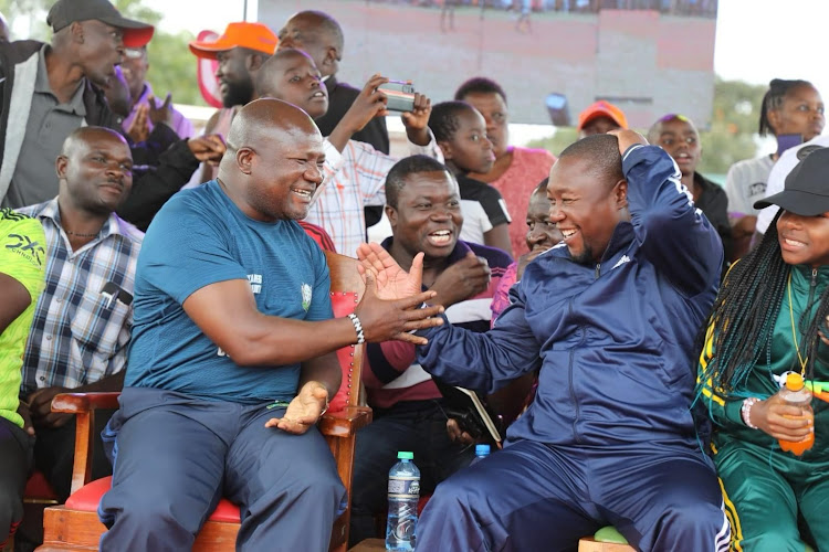 Kakamega Governor Fernandes Barasa, Likuyani MP Innocent Mugabe celebrate during a football match in Likuyani constituency