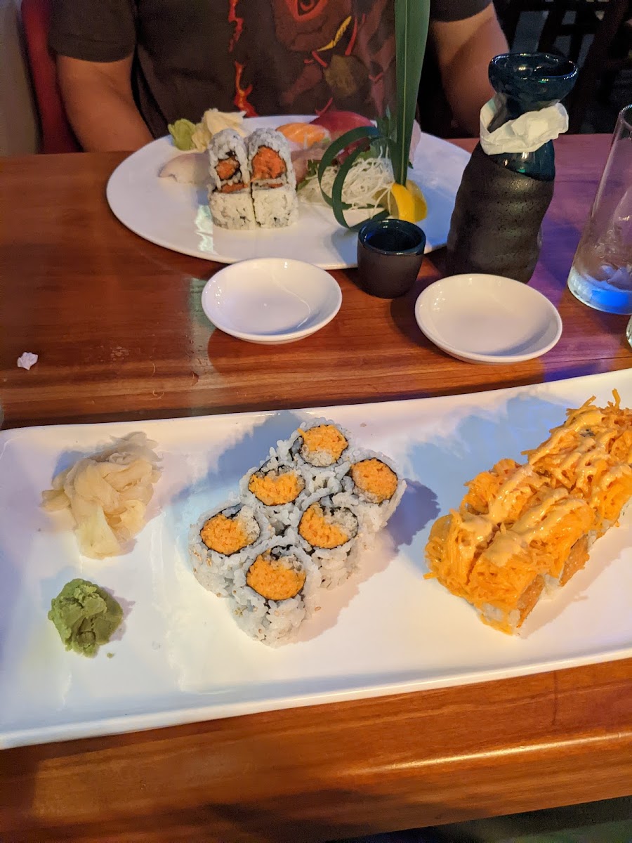 My meal (closest) is not gluten free, but my husband had suahi, sashimi, and a gluten free roll (farther).