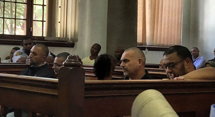 Nafiz Modack (from left), Colin Booysen, Ashley Fields (obscured), Jacques Cronje and Carl Lakay in the dock at Cape Town Magistrate's Court on Tuesday.