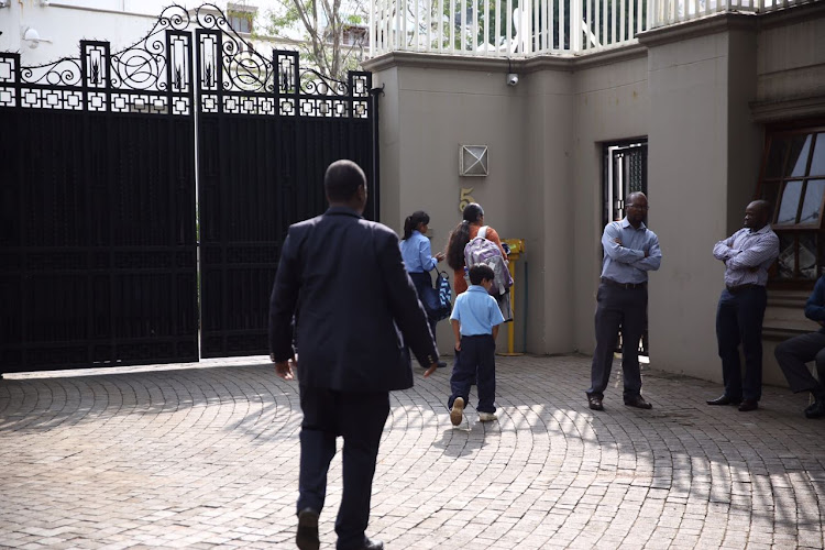 Private security at the compound initially refused to let the authorities in, but that they later relented.