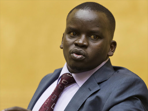 Journalist Joshua Sang looks on in a courtroom before a trial at the International Criminal Court (ICC) in The Hague in this September 10, 2013 file photo. Photo/REUTERS