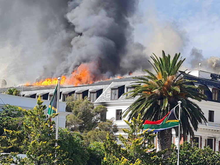 A contractor is expected to begin demolition of buildings destroyed by a fire in the parliamentary precinct in January 2022. File photo.