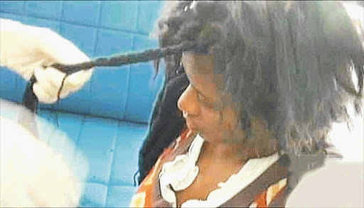 WEB OF DECEPTION: South African drug mule Nolubabalo Nobanda, arrested at Bangkok's international airport with cocaine hidden in her dreadlocks in December, was sentenced to an effective 15 years' imprisonment by a Thai court. File photo