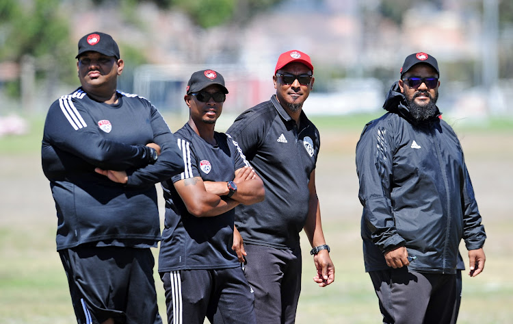 The Magic FC technical team from left to right: Assistant coach Zane Alexander, head coach David Kannemeyer, assistant Zane Ryklief and goalkeeper coach Shivaan Sayed look on during a training session at Royal Road Fields in Cape Town on February 12 2019.