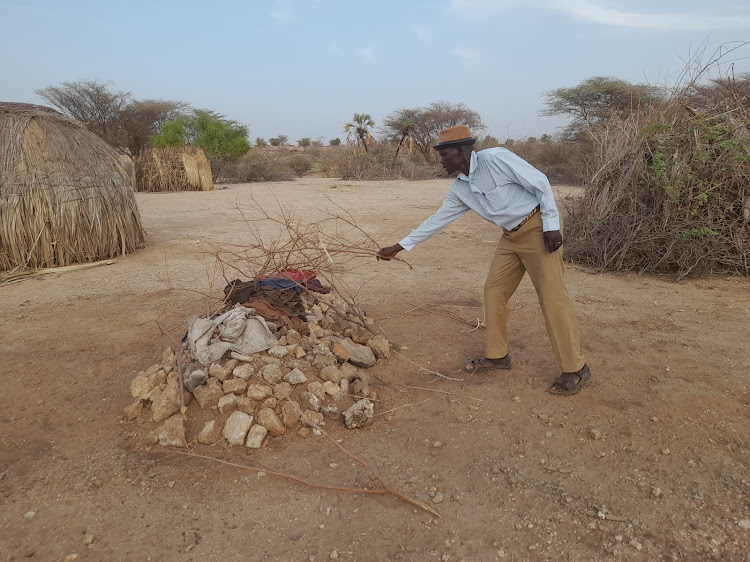 Martin Lokeyen, assistant Chief of Turkwel Location in Loima Sub County disclosing the grave of a woman killed by hunger occasioned by famine that has led to the death of six people in Muruese.