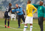 Gavin Hunt with Gift Motupa of Bidvest Wits during the Absa Premiership match between Bidvest Wits and Mamelodi Sundowns at Moses Mabhida Stadium on December 17, 2019 in Durban, South Africa.