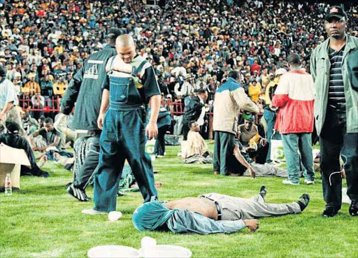 South African rescue services work around victims of a stampede Ellis Park in Johannesburg on 11 April 2001. 43 people died in the stampede Picture: SowetaSouth African rescue services work around victims of a stampede Ellis Park in Johannesburg on 11 April 2001. 43 people died in the stampede Picture: Sowetan