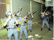TAKING AIM: Police maintaining order in Hillbrow last year. Inset, Minister Nathi Mthethwa asks residents of Hillbrow to avoid committing crime and armed robberies.