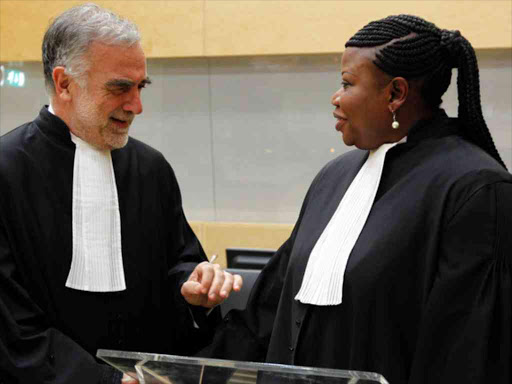 Luis Ocampo with his successor Fatou Bensouda at the International Criminal Court in The Hague, June 2012. /REUTERS