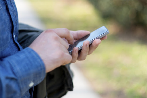 Man with cellphone. File photo