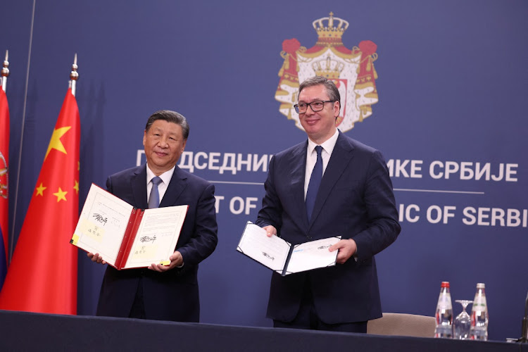 Chinese President Xi Jinping and Serbian President Aleksandar Vucic display signed documents, during the Chinese president's two-day state visit in Belgrade, Serbia, May 8 2024. Picture: REUTERS/MARKO DJURICA