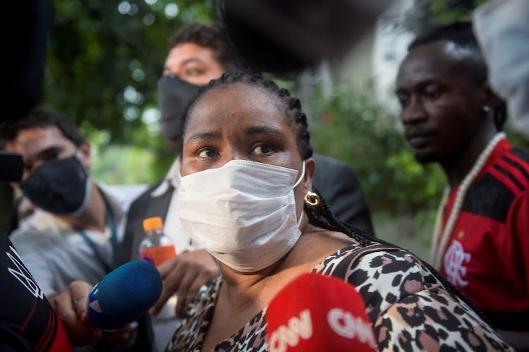 Lotsove Lolo Lavy Ivone, mother of Congolese refugee Moise Kabagambe who was beaten in a beachside kiosk, leaves a police station after giving her statement in Rio de Janeiro, Brazil, February 2, 2022.