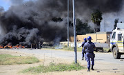 Police patrol the area during violent protests on April 19, 2018 in Mahikeng. File photo.