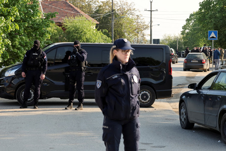 Security personnel operate, in the aftermath of a shooting, in Dubona, Serbia, May 5 2023. Picture: REUTERS/ANTONIO BRONIC.