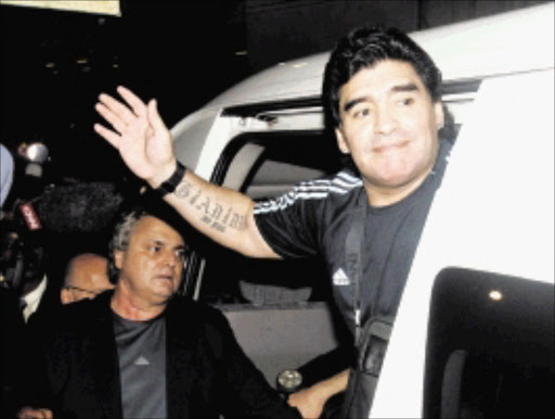 WELCOME AMIGO: Argentina coach Diego Maradona at OR Tambo International Airport in Kempton Park yesterday.Pic: VELI NHLAPO. 18/01/2010. © Sowetan. 20100118VNH. Argentina coach Diego Maradona has arrived at O.R. Tambo International Airport in Johanneburg to review preparations for his team's stay in the country during this year's World Cup.PHOTO:VELI NHLAPO.