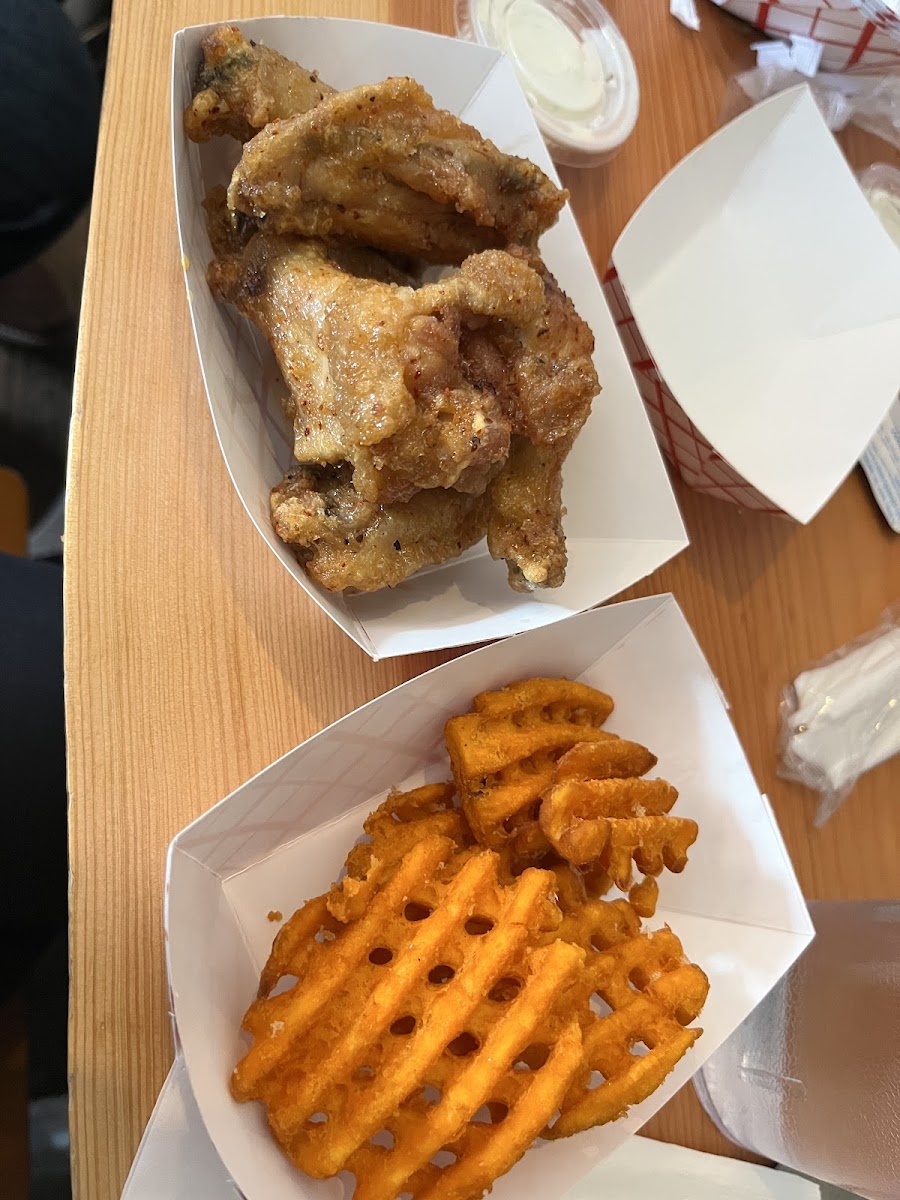 Traditional wings wirh Mama's Sweet & Salty sauce and sweet potato fries