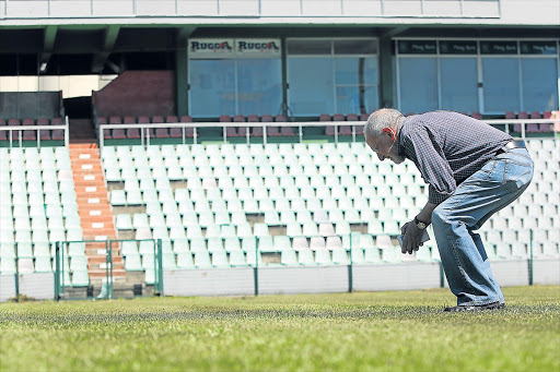 GETTING UP CLOSE: Premier Soccer League chief operations officer Ronnie Schloss conducts an inspection of the Buffalo City Stadium in East London Picture: SIBONGILE NGALWA