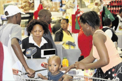 CASHING up: The festive season and all the extra people shopping creates job openings in the retail sectorPHOTO: MBUZENI ZULU