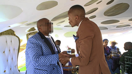 Groom Brian Makau is confronted by TV presenter Moss Makwati at his wedding for failing to pay papgeld.