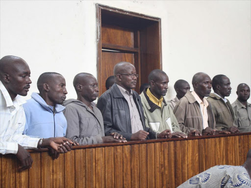 The seven suspects accused of killing police officers in Baragoi ina Nakuru court on December 6, 2012. The defense has dismissed the evidence against the suspects.