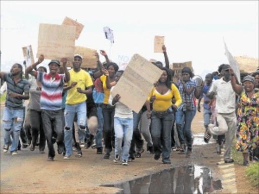 UP IN ARMS: Residents of Malamulele protest on Wednesday outside the local magistrate's court during the appearance of three men accused of theft in the area . PHOTO: Benson Ntlemo