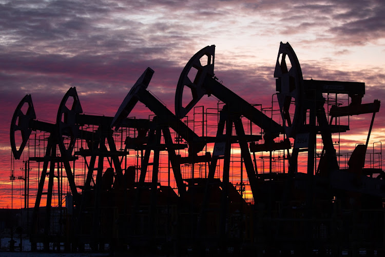 Oil pumping jacks in an oil field at sunset in Russia. Picture: BLOOMBERG/ANDREY RUDAKOV