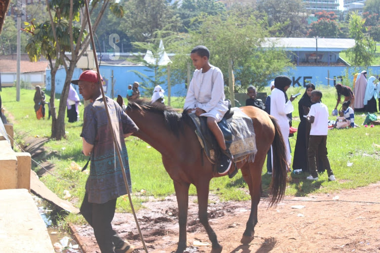 A child riding a horse during the Eid Mubarak celebrations at Uhuru Park, Nairobi on April 10, 2024.