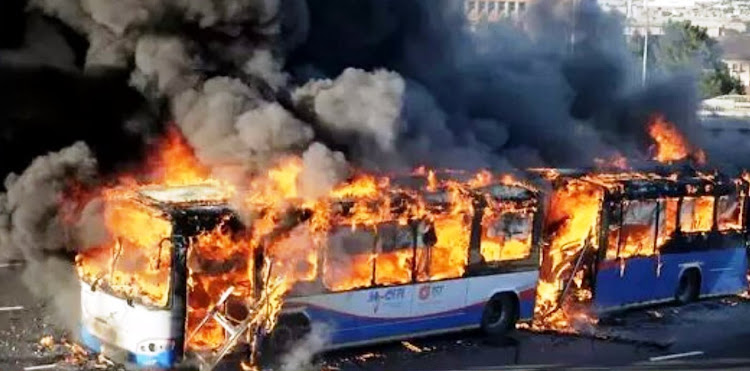 A MyCiTi bus goes up in flames during unrest in the Dunoon and Joe Slovo areas of Cape Town on September 27 2019.