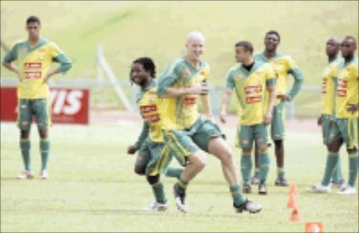 LONG AND SHORT: Bafana Bafana's MacBeth Sibaya and Mathew Booth go through their paces during training at Pilditch Stadium in Pretoria on Tuesday. Pic. Sydney Mahlangu. 06/10/2008. © Backpagepix.
