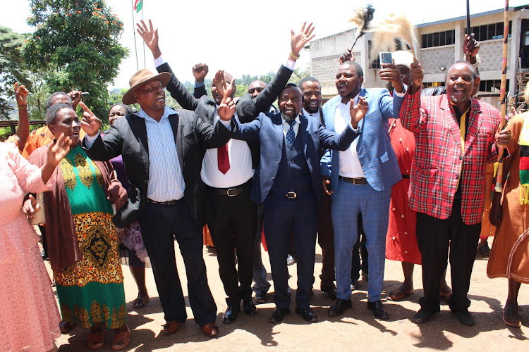Elders and lawyers celebrating outside Murang'a law courts on February 28, 2024.