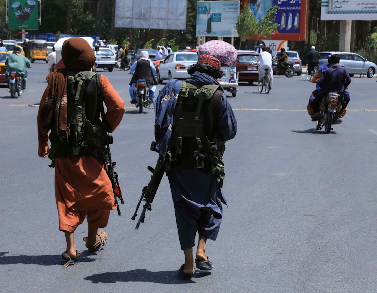 Taliban forces patrol a street in Herat, Afghanistan, on August 14 2021.