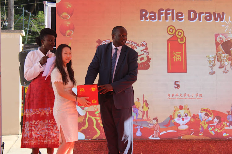 Kenya-China Alumni Association chairman Dr. Henry Rotich during the raffle draw at 'The Dragon is soaring and the drums are rolling for the Chinese New Year' event at the UoN Confucius Institute on February 7, 2024