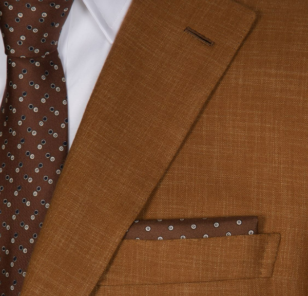 Brioni light brown micro motif silk tie.