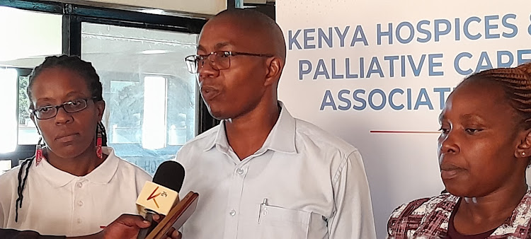 Director of Programmes at the Kenya Hospices and Palliative Care Association (KEHPCA) David Musyoki (C) with other medics speaking during a training in Eldoret on March 22nd 2024