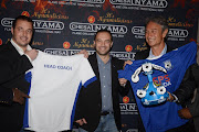 Muhsin Ertugral (far right) smiles during his announcement as the new head coach for Black Aces at a media briefing in Johannesburg on 12 May 2015 alongside co-chairmen Mario and George Morfou. Ertugral signed for a two-year deal. Aces announced on 7 July 2015 that the club will no longer be selling their PSL status to AmaZulu for the 2015/16 season.