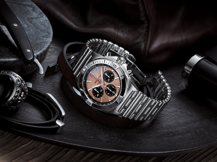 Breitling Chronomat B01 42 with salmon dial and black contrasting chronograph counters.