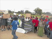 FED-UP:
       Pupils and community members chant 
      
       in front of the court this week 
      
       after the appearance of 
      
       taxi driver Selby Sambo, who is  accused of raping pupils  
      
       at Langeloop. 
      Photo: Sibongile Mashaba