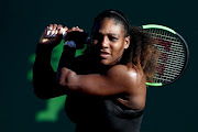 Serena Williams returns a shot to Naomi Osaka of Japan during the Miami Open Presented by Itau at Crandon Park Tennis Center on March 21, 2018 in Key Biscayne, Florida. 
