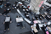 The Anti-GBV movement demonstrated outside parliament in Cape Town.