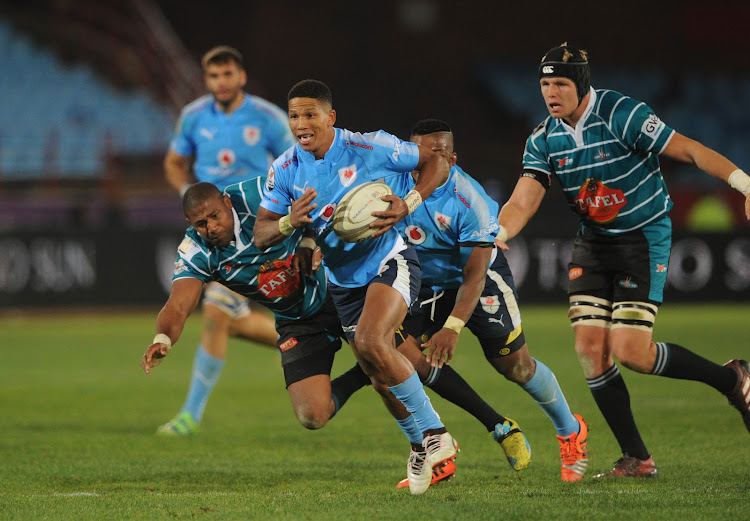 Manie Libbok of Blue Bulls evades a tackle from Jonathan Francke of Griquas during the Currie Cup rugby match on the 01 September 2017 at Loftus Versfeld Stadium.