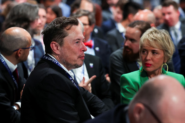 Elon Musk, CEO of Tesla and X, sits with delegates at the AI Safety Summit in Bletchley Park, near Milton Keynes in Britain, on November 1 2023. Picture: REUTERS/TOBY MELVILLE/POOL