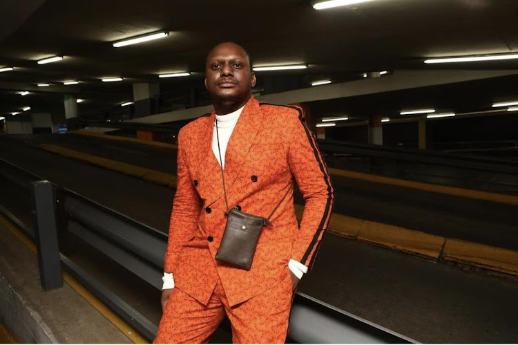 Emmanuel Tjiya receives a Fashion Journalist of the Year award at the inaugural Fashion Industry Awards SA.