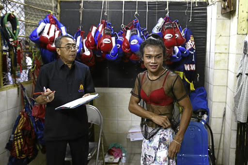 TOUGH COOKIE Muay Thai boxer Nong Rose Baan Charoensuk, 21, who is transgender, prepares to be weighed before her match at the Rajadamnern Stadium in Bangkok earlier this month.