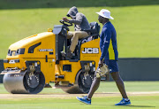 Coach Ottis Gibson going about his business as the pitch is being prepared too during the South African national men's cricket team training session and press conference at SuperSport Park on January 12, 2018 in Pretoria, South Africa.