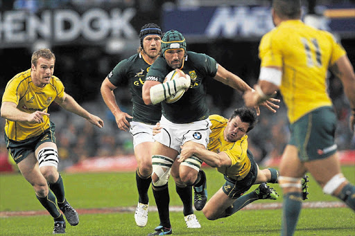 Victor Matfield fends off a tackle from Adam Ashley- Cooper in the tri-nations test match between the Springboks and the Wallabies in Durban