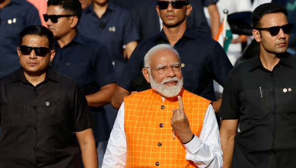 India's Prime Minister Narendra Modi shows his ink-marked finger after casting his vote, outside a polling station during the third phase of the general election, in Ahmedabad, India, on May 7, 2024. Picture: REUTERS/ADNAN ABIDI