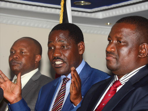 ITS NOT ENOUGH: Kericho Governor Paul Chepkwony, Council of Governors chairman Peter Munya (Meru) and Kwale Governor Salim Mvurya address the press at Delta House, Nairobi, yesterday.