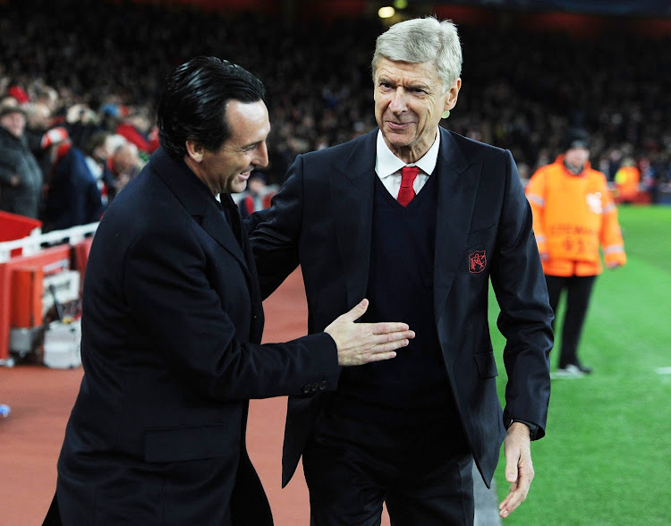Arsene Wenger the Arsenal Manager with Unai Emery the Manager of PSG before the UEFA Champions League match between Arsenal FC and Paris Saint-Germain at Emirates Stadium on November 23, 2016 in London, England.